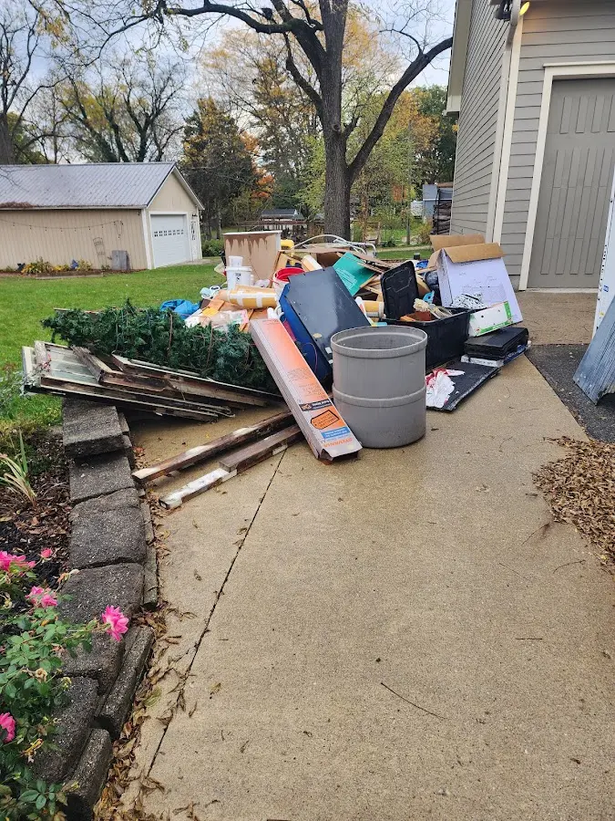 Dumpster being loaded with debris for Commercial Dumpster Rental in Tallahassee